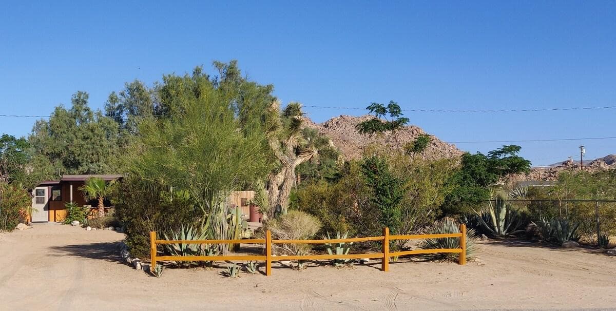 Joshua Tree Bungalow entrance behind a low wooden fence