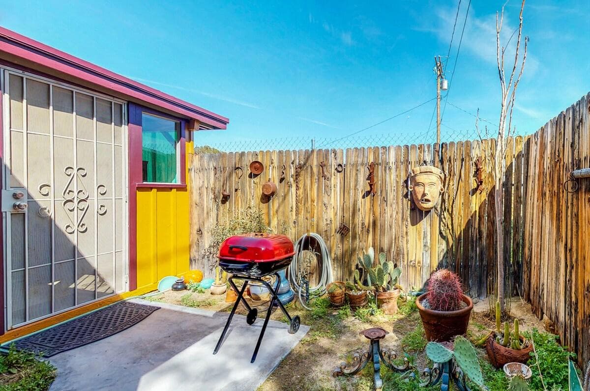 Colorful garden patio with barbecue and desert art
