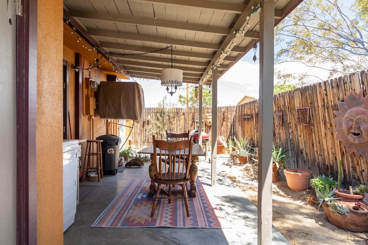 Covered outdoor dining area beside Joshua Tree Bungalow
